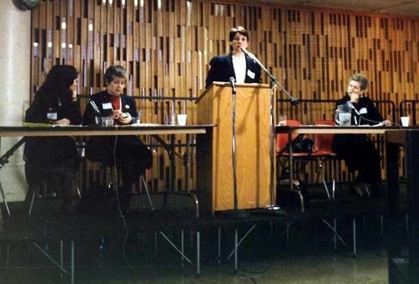 1986. Phyllis Chesler speaks at the (first-ever) March 1, 1986 New York City Custody Speak Out, which she coordinated with Noreen Connell. On stage with her are, from the left, Ruth Cecire, Noreen Connell, and Paula Caplan.