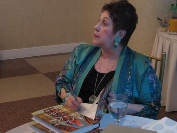 Phyllis Chesler signing books at the Middle East Forum meeting.