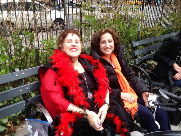 This is a photo of two grandmothers enjoying their granddaughter's fourth birthday party in the park.